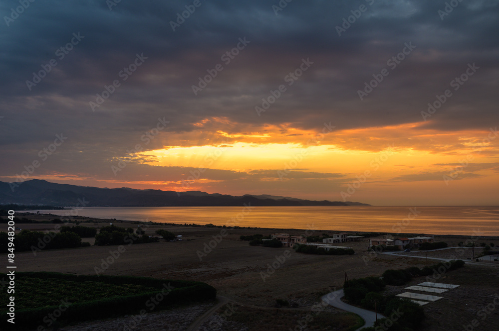 Fototapeta premium Full frame of the low angle view of sky and clouds of yellow and orange color and the in the sunset.