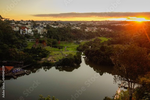 Tangua park lake and condominium houses in Curitiba, Brazil. Panoramic, sunset