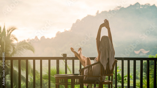 Woman enjoying a peaceful morning in a tropical setting