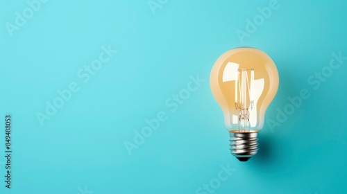 Light bulb on blue background. Concept of idea, innovation and creativity.