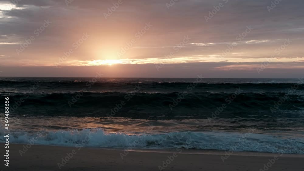waves of the altlantic ocean crushing onto the beach at the cote de argent in France with golden sunset in the background, Cap Ferret, Aquitaine, France waves of the altlantic ocean crushing onto the beach at the cote de argent in France with golden sunset in the background, Cap Ferret, Aquitaine, France
