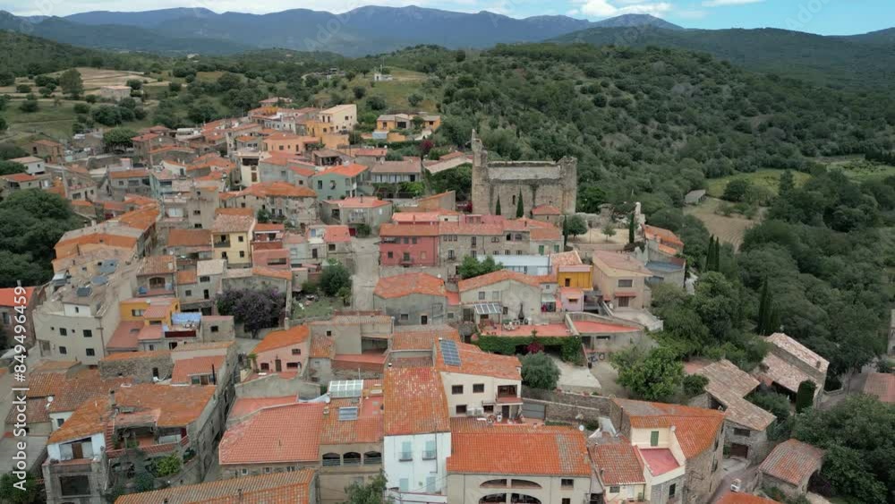 Aerial drone images of Rabos, a small medieval town in the mountains of Catalonia in Spain, surrounded by green vineyards Aerial drone images of Rabos, a small medieval town in the mountains of Catalonia in Spain, surrounded by green vineyards