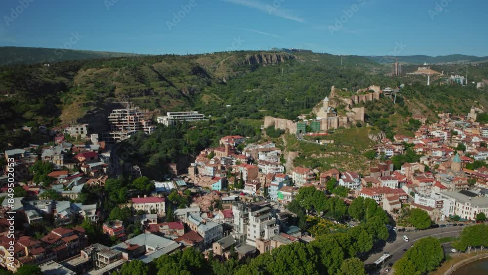 Aerial view On Ancient District Abanotubani Of Tbilisi. Georgian Capital Skyline Cityscape. Aerial view On Ancient District Abanotubani Of Tbilisi. Georgian Capital Skyline Cityscape.