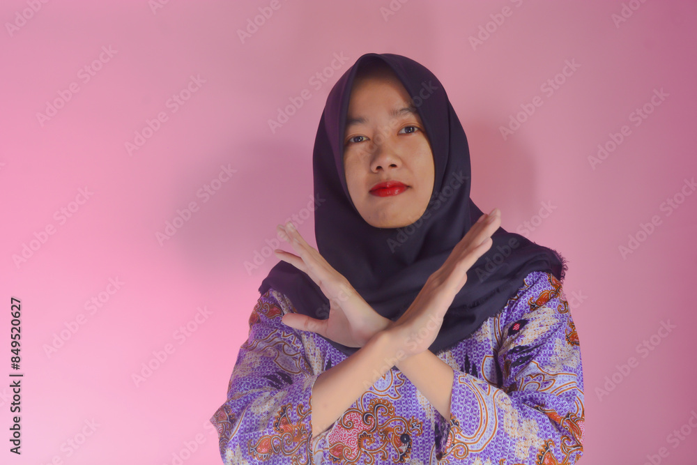 A woman shows a stop gesture and refuses A woman shows a stop gesture and refuses