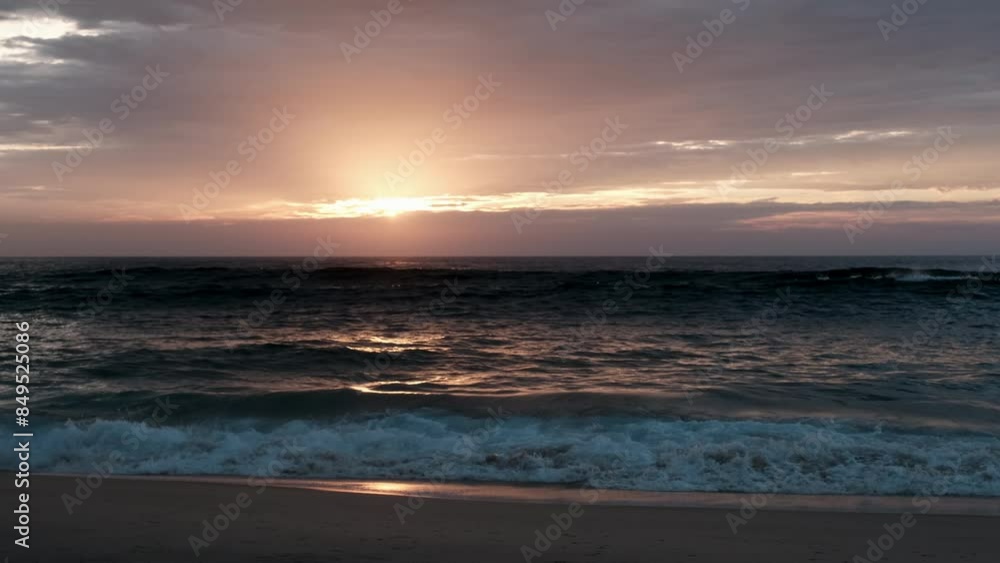 waves of the altlantic ocean crushing onto the beach at the cote de argent in France with golden sunset in the background, Cap Ferret, Aquitaine, France waves of the altlantic ocean crushing onto the beach at the cote de argent in France with golden sunset in the background, Cap Ferret, Aquitaine, France