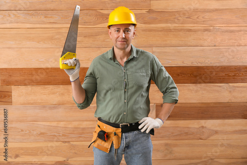 Mature carpenter in hardhat...