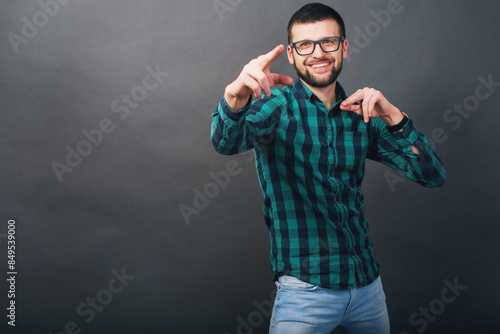young handsome hipster bearded man on grey background
