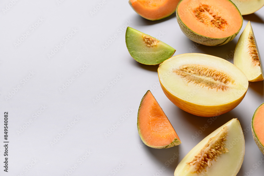 Pieces of sweet melon on grey background Pieces of sweet melon on grey background