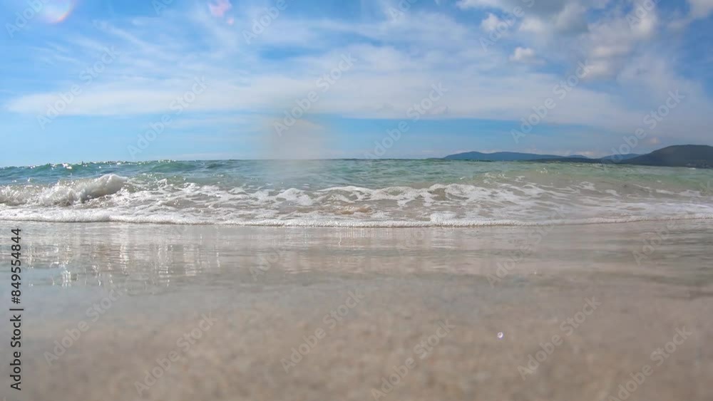 Small waves on the beach seen from the ground. Sardinia, Italy Small waves on the beach seen from the ground. Sardinia, Italy