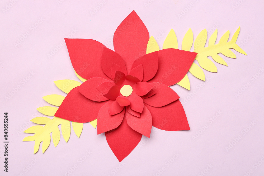 Red origami flower with leaves on purple background Red origami flower with leaves on purple background