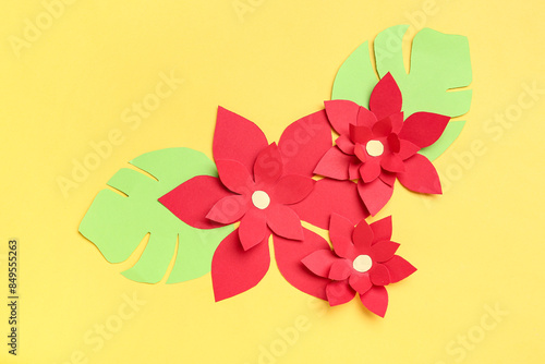 Red origami flowers with le...