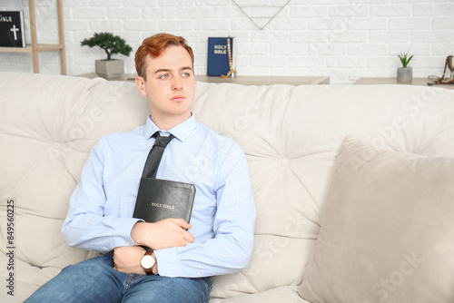 Young redhead man with Bibl...