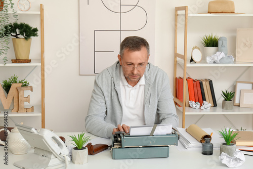 Mature man with scroll and ...