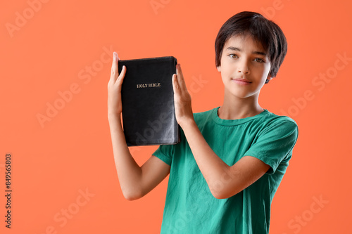Little boy with Bible on or...