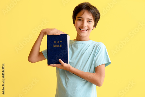 Little boy with Bible on ye...