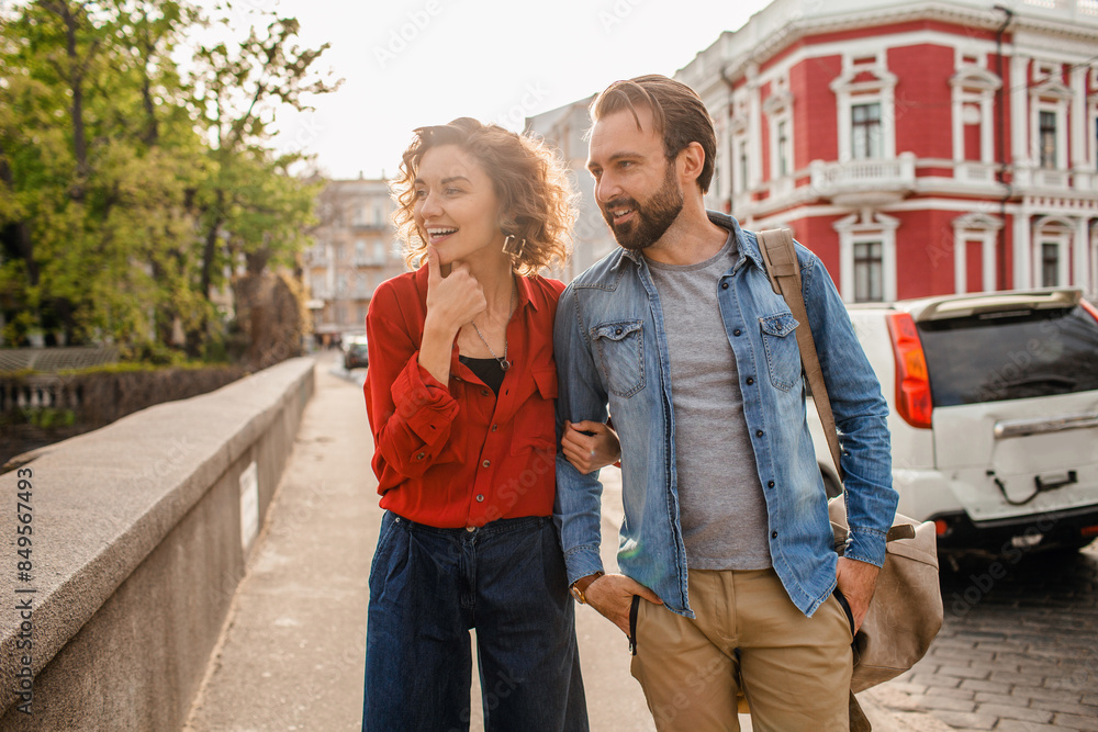 Fototapeta premium man and woman on romantic vacation walking together