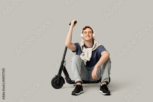 Young man in headphones wit...