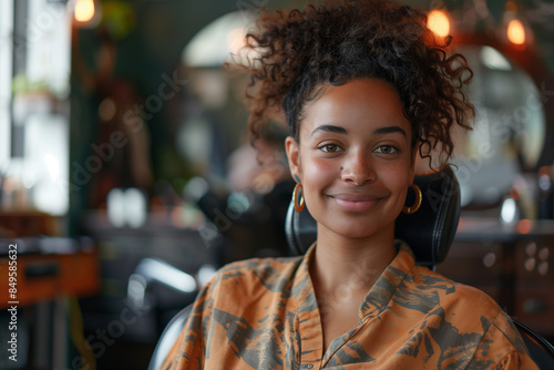 African American female customer smiling confidently in hair salon.