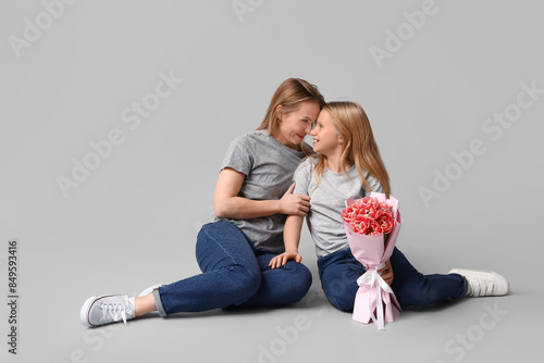Cute little girl with her m...