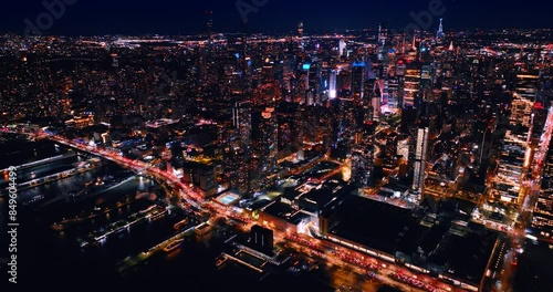 Wallpaper Mural Hundreds of car stand on the highway at the waterfront of the East River at night. Luminous panorama of New York, the USA from top. Torontodigital.ca