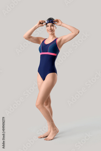 Female swimmer on light bac...