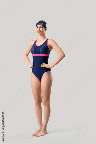 Female swimmer on light bac...