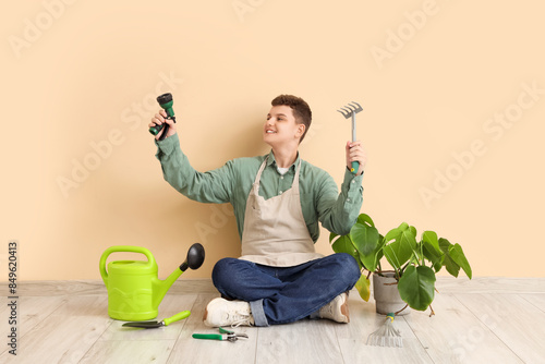 Teenage gardener with tools...