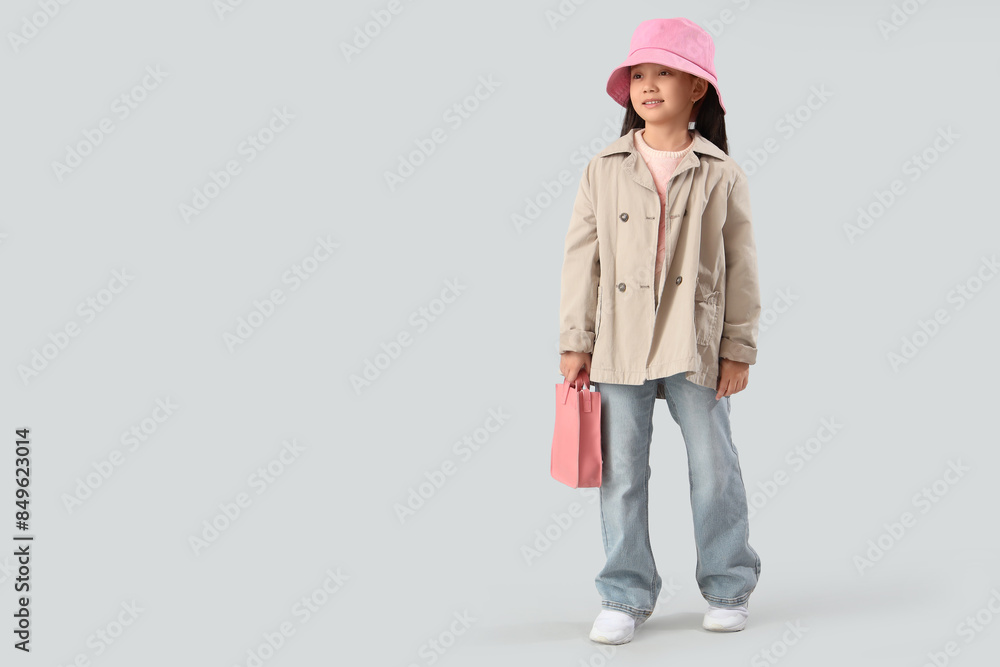 Portrait of fashionable little girl with handbag on white background Portrait of fashionable little girl with handbag on white background