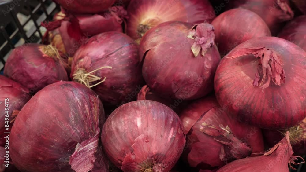 Fresh red onions displayed at an Italian market, highlighting the vibrant color and rich flavor typical of Italian summer produce. Fresh red onions displayed at an Italian market, highlighting the vibrant color and rich flavor typical of Italian summer produce.