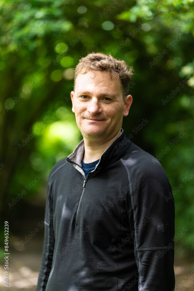 Outdoor portrait of a 45 yo white man with a green bokeh background, Brussels, Belgium Outdoor portrait of a 45 yo white man with a green bokeh background, Brussels, Belgium