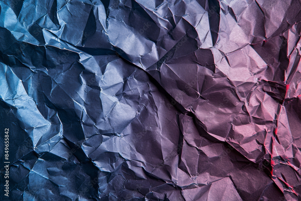 Close-up of crumpled paper with blue and purple gradients Close-up of crumpled paper with blue and purple gradients