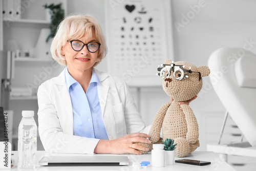 Female oculist and toy bear...