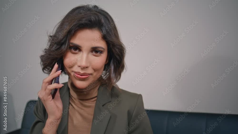 Successful professional calling cellphone in corporate office setting closeup. Successful professional calling cellphone in corporate office setting closeup.