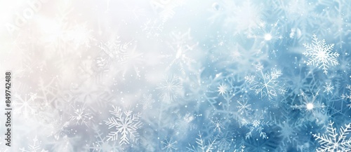 Step into a serene winter wonderland with delicate snowflakes falling against a dreamy blue and white backdrop. Perfect for holiday projects. Create a stunning visual experience with this snowy scene