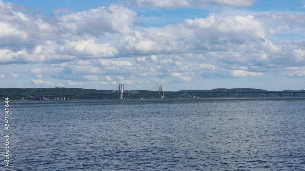 water flowing in the hudson river with view of new tappan zee bridge between tarrytown and nyack westchester upstate new york rockland (mario cuomo governor suspension) still footage moving clouds water flowing in the hudson river with view of new tappan zee bridge between tarrytown and nyack westchester upstate new york rockland (mario cuomo governor suspension) still footage moving clouds
