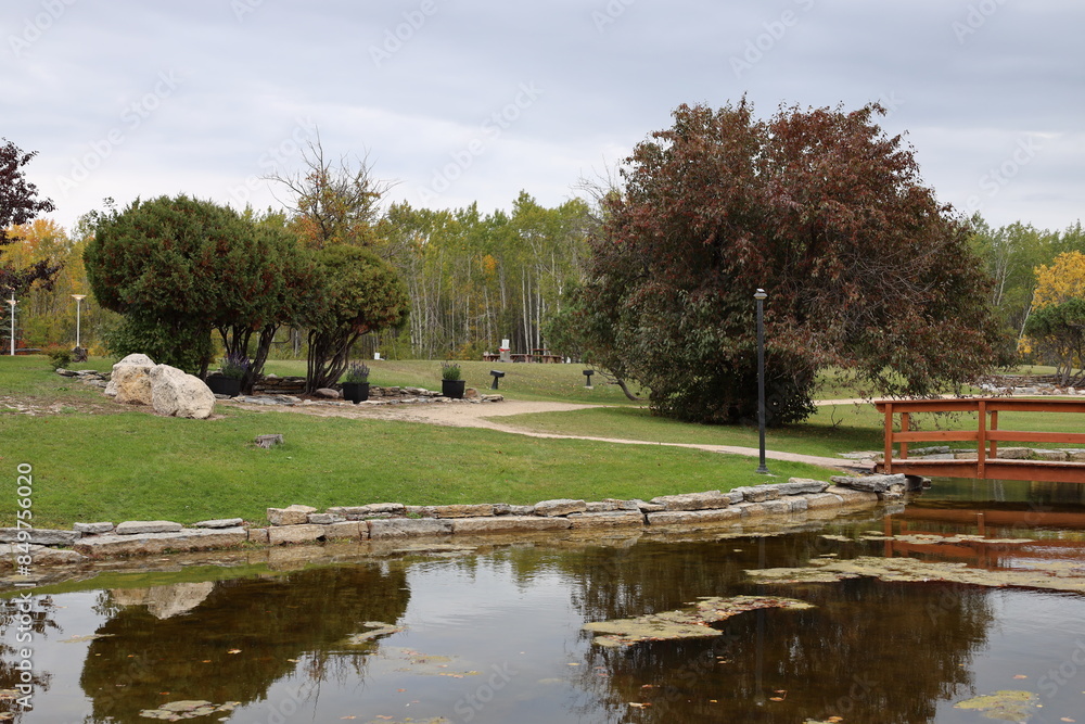 pastoral landscape reflected in a pond in autumn pastoral landscape reflected in a pond in autumn