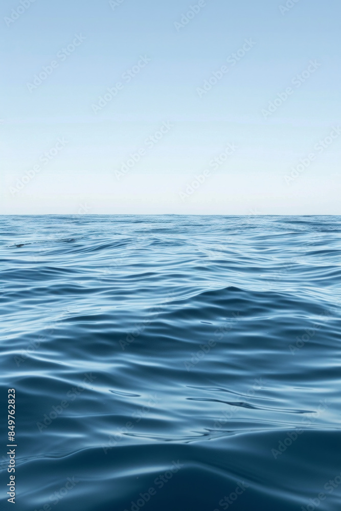 A solitary wave in a calm sea under a clear sky. A solitary wave in a calm sea under a clear sky.