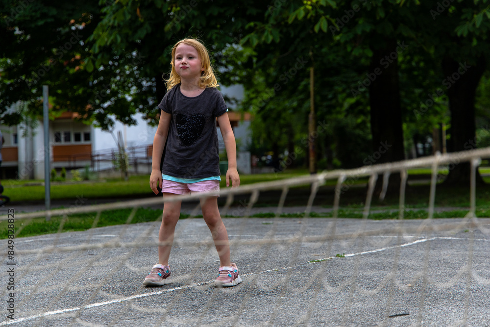 Young Girl Playing on Outdoor Court in the Daytime Young Girl Playing on Outdoor Court in the Daytime