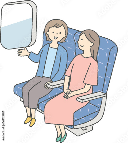 電車に乗る二人の女性