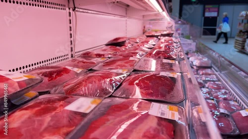 Chilled Meat Display: Supermarket Open Refrigerator with Fresh Pork Fillet, Beef Steaks, Turkey Cuts in Plastic Containers