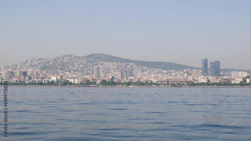 Aerial cityscape of modern architecture against a clear blue sky with hills in the background Aerial cityscape of modern architecture against a clear blue sky with hills in the background