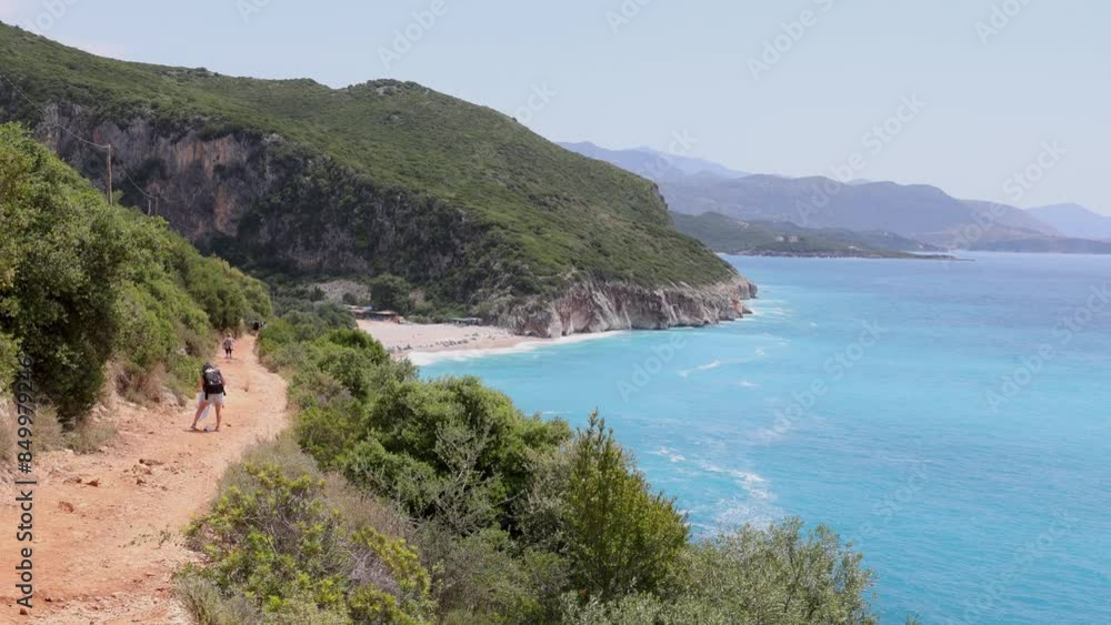 Tourists visit Gjipe Beach located between Dhermi and Himara on the Ionian Sea along the southern Albania riviera Tourists visit Gjipe Beach located between Dhermi and Himara on the Ionian Sea along the southern Albania riviera