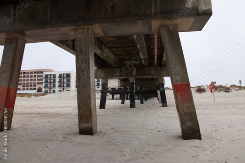 Boardwalk and pier on the beach across the ocean mid-morning. Jacksonville, Florida.