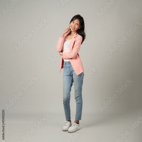 full lenght shoot of happy asian woman wearing formal casual outfit on isolated background