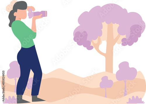 A woman photographer is taking pictures of nature.