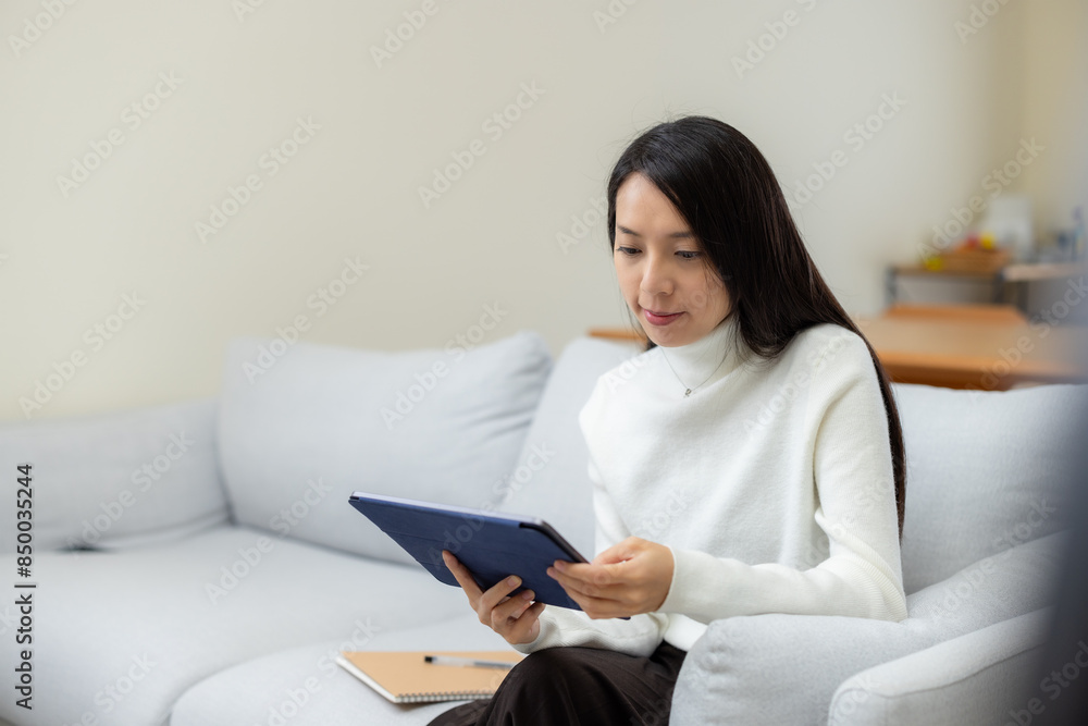 Woman watch on tablet computer at home Woman watch on tablet computer at home