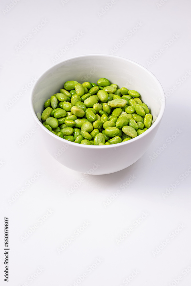 Green steamed soybeans, shelled edamame in a bowl close-up Green steamed soybeans, shelled edamame in a bowl close-up