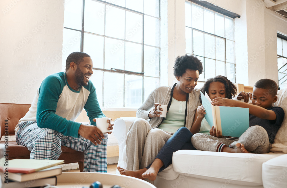 Reading, relax and black family with book on sofa for bonding together on fathers day at home. Smile, knowledge and African parents drinking coffee with children in living room with story or novel. Reading, relax and black family with book on sofa for bonding together on fathers day at home. Smile, knowledge and African parents drinking coffee with children in living room with story or novel.