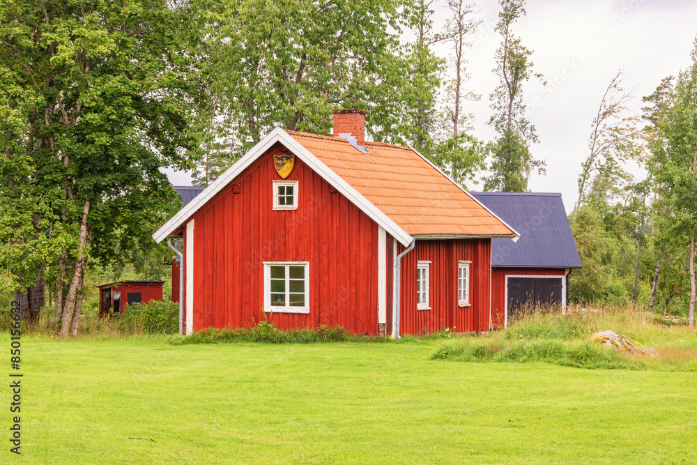 Idyllic old red cottage in the countryside