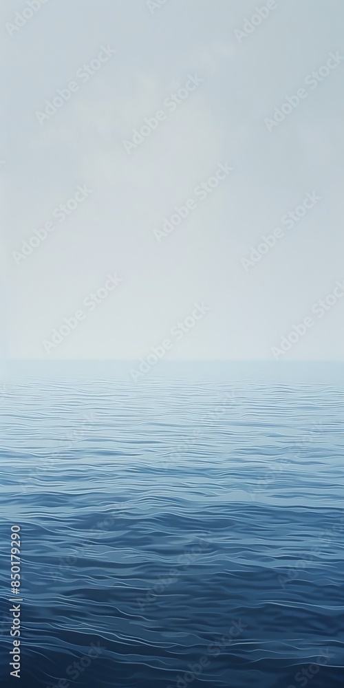 The ocean is calm and peaceful, with a few clouds in the sky The ocean is calm and peaceful, with a few clouds in the sky